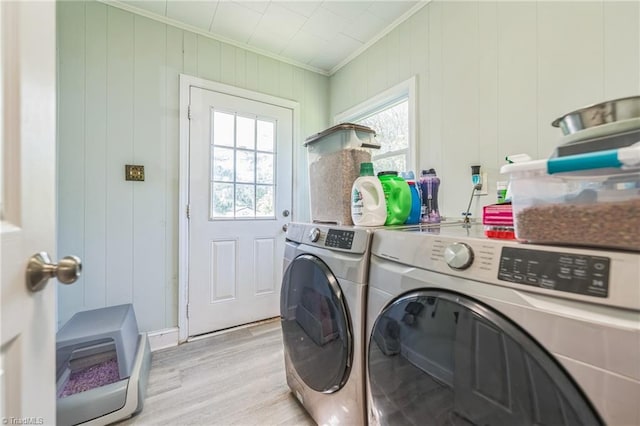3121 Luther St, Winston-Salem, NC 27127 - laundry room with crown molding, separate washer and dryer, and light wood-style floors