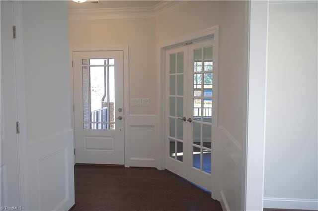 doorway with french doors, dark wood-type flooring, and ornamental molding