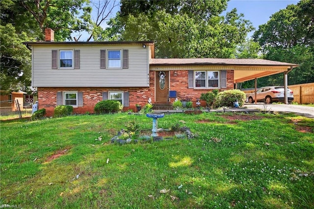 214 Stokes Forest Dr, King, NC 27021 - tri-level home with a chimney, driveway, an attached carport, and brick siding