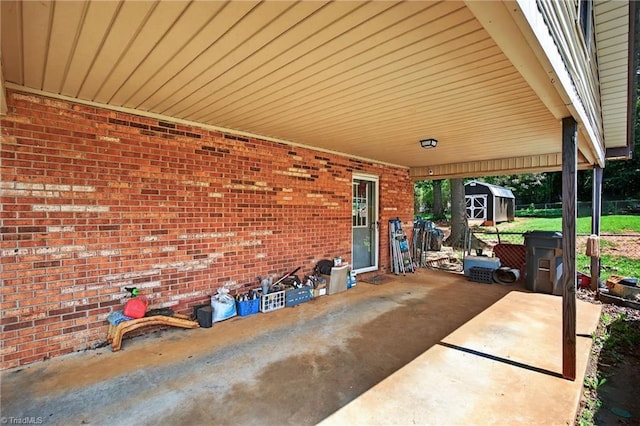 214 Stokes Forest Dr, King, NC 27021 - view of patio with a storage shed and an attached carport