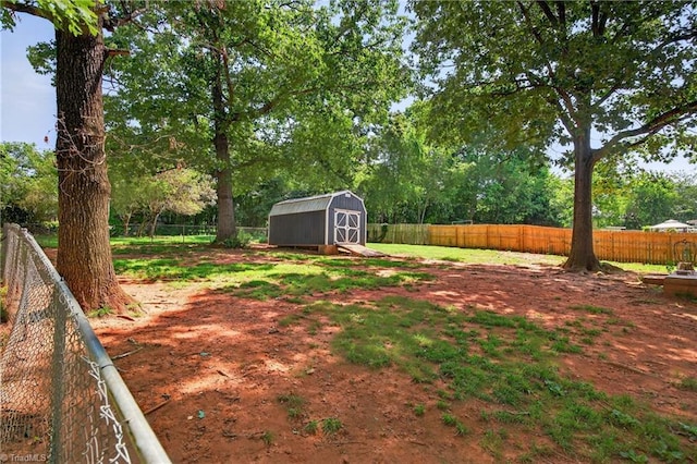 214 Stokes Forest Dr, King, NC 27021 - fenced backyard with a storage shed and view of wooded area