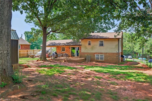 214 Stokes Forest Dr, King, NC 27021 - rear view of house featuring a patio and brick siding