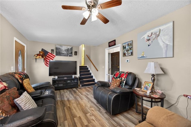 214 Stokes Forest Dr, King, NC 27021 - living area with a textured ceiling, wood finished floors, a ceiling fan, and stairway