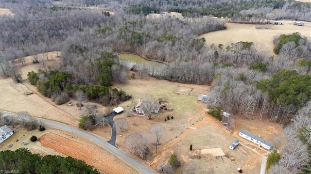 bird's eye view featuring a rural view and a forest view