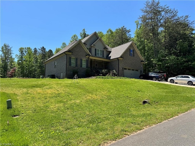 3064 Wesley Farm Ln, Sophia, NC 27350 - view of front of property with a front lawn, a garage, brick siding, and cooling unit