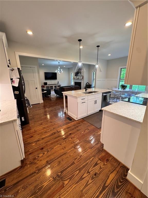 3064 Wesley Farm Ln, Sophia, NC 27350 - kitchen featuring open floor plan, a sink, black appliances, white cabinets, and dark wood finished floors