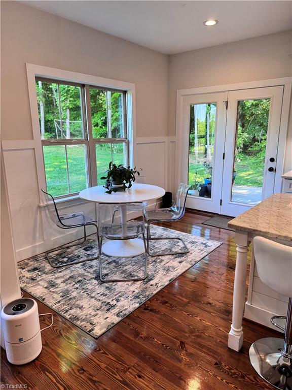 3064 Wesley Farm Ln, Sophia, NC 27350 - dining room with a decorative wall, hardwood / wood-style flooring, plenty of natural light, a wainscoted wall, and recessed lighting