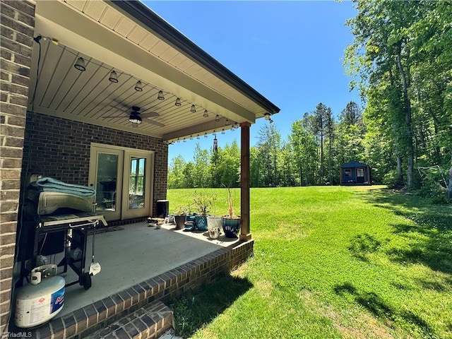 3064 Wesley Farm Ln, Sophia, NC 27350 - view of green lawn with ceiling fan, a patio, an outdoor structure, and a shed