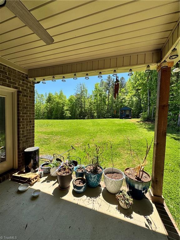 3064 Wesley Farm Ln, Sophia, NC 27350 - view of grassy yard with a patio