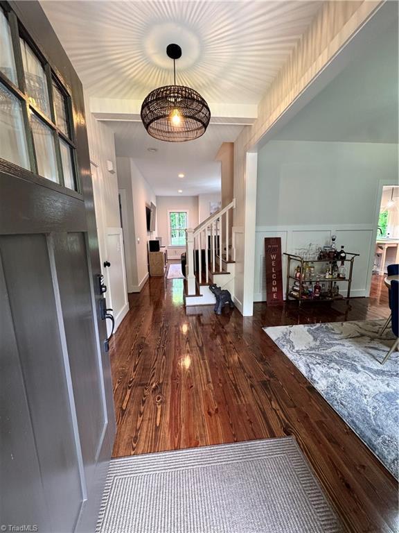 3064 Wesley Farm Ln, Sophia, NC 27350 - foyer entrance with wood finished floors, stairway, and baseboards