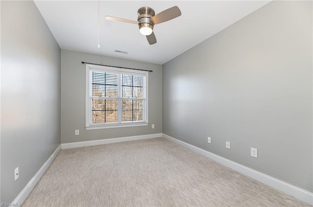 empty room with light carpet and ceiling fan