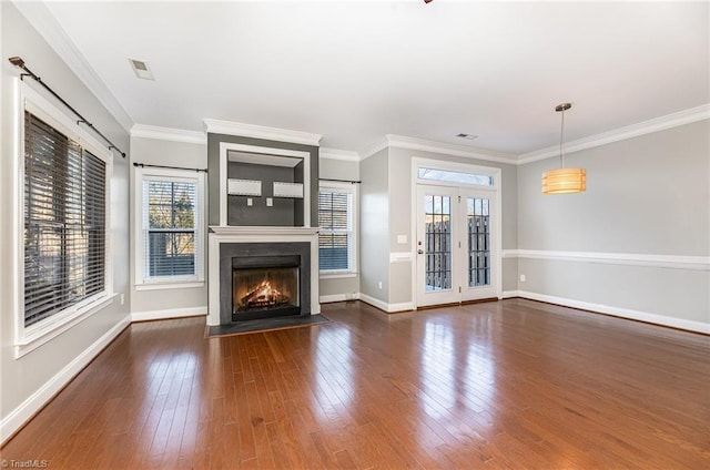 unfurnished living room with crown molding and dark hardwood / wood-style floors