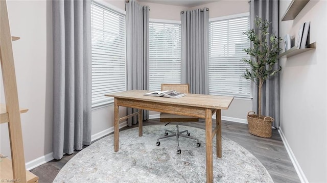 home office with hardwood / wood-style floors