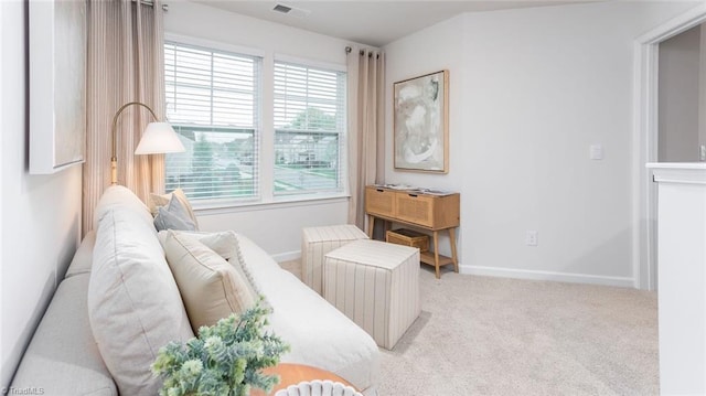 living area with light colored carpet