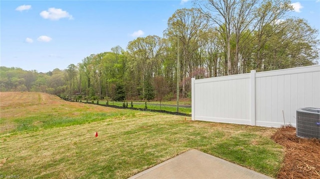 view of yard with central AC