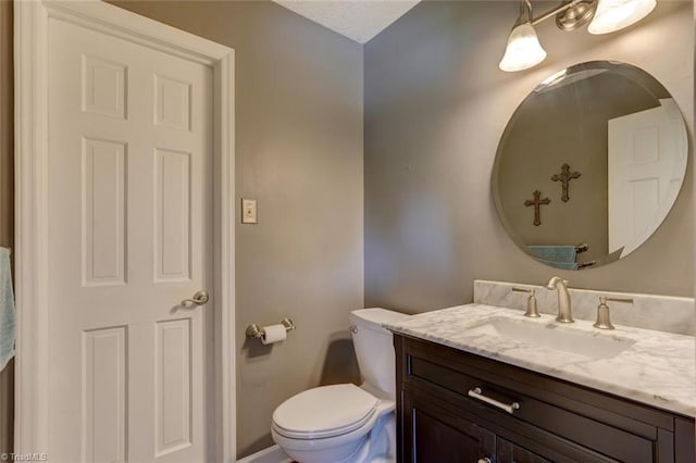 1274 Candlewood Dr, Elon, NC 27244 - bathroom featuring toilet, vanity, and baseboards