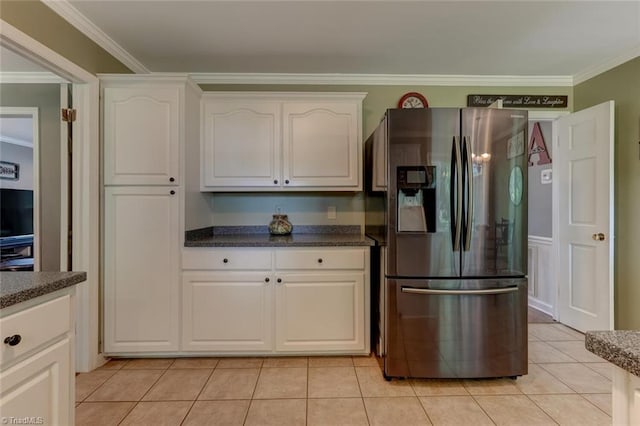 1274 Candlewood Dr, Elon, NC 27244 - kitchen with stainless steel fridge, white cabinetry, light tile patterned floors, and ornamental molding