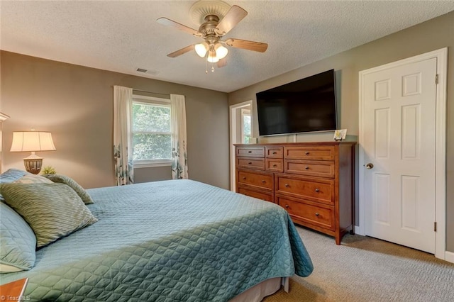 1274 Candlewood Dr, Elon, NC 27244 - bedroom featuring light carpet, a textured ceiling, and a ceiling fan