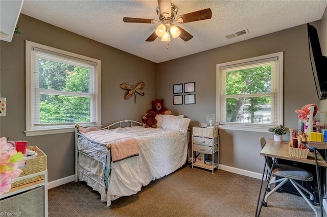 1274 Candlewood Dr, Elon, NC 27244 - carpeted bedroom featuring a textured ceiling, baseboards, ceiling fan, and an office area