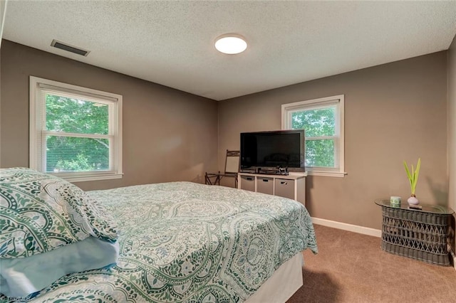 1274 Candlewood Dr, Elon, NC 27244 - carpeted bedroom featuring a textured ceiling and baseboards