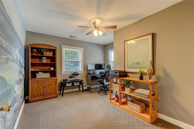 1274 Candlewood Dr, Elon, NC 27244 - home office featuring ceiling fan, a textured ceiling, light colored carpet, and baseboards
