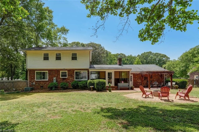 1274 Candlewood Dr, Elon, NC 27244 - rear view of property featuring a fire pit, a patio area, brick siding, a chimney, and central air condition unit