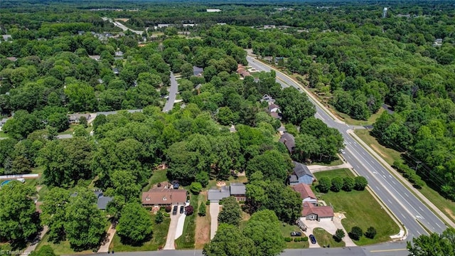 1274 Candlewood Dr, Elon, NC 27244 - aerial view of property and surrounding area with a heavily wooded area