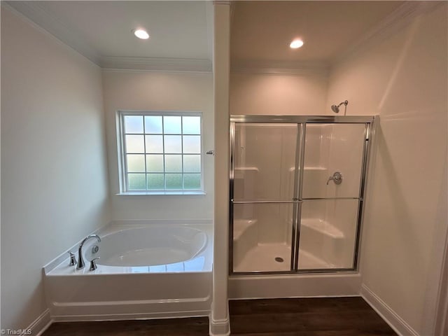 bathroom with crown molding, separate shower and tub, and wood-type flooring