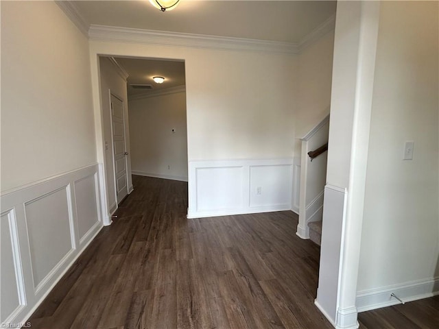 corridor featuring ornamental molding and dark hardwood / wood-style flooring