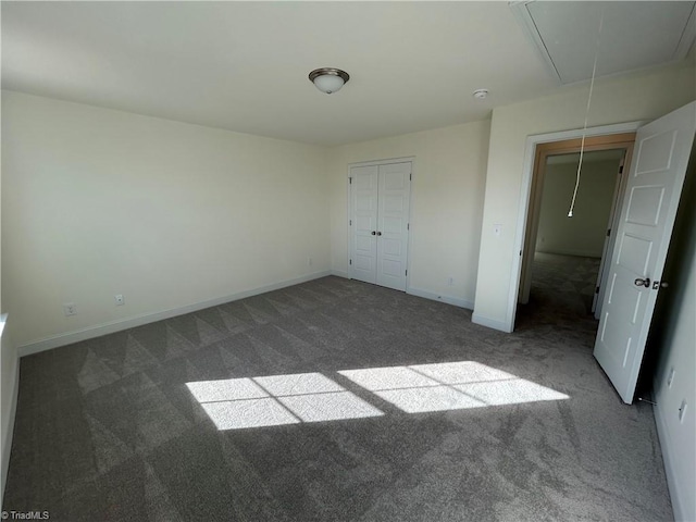 unfurnished bedroom featuring dark carpet