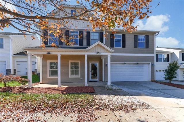 view of front of property featuring a porch and a garage