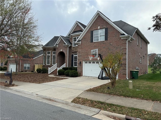 view of front property with a garage and a front lawn