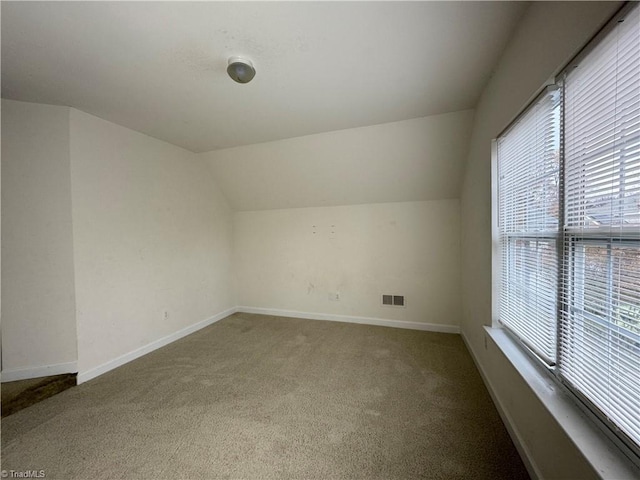 bonus room featuring carpet and lofted ceiling