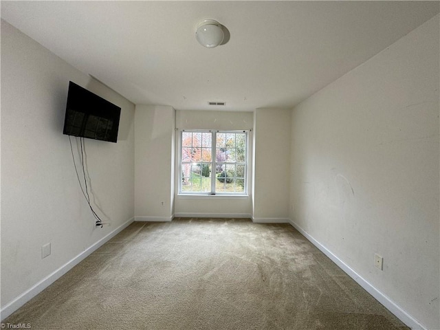 spare room featuring carpet flooring