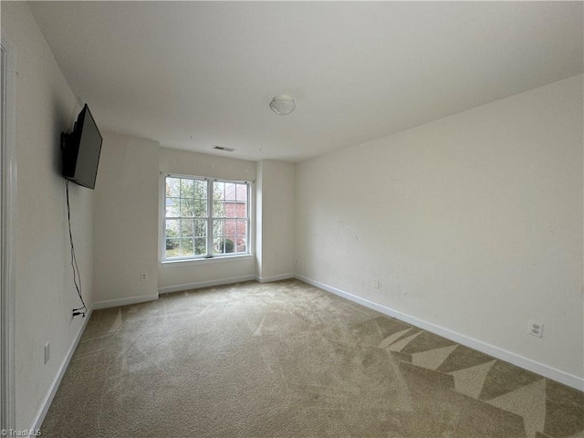 spare room featuring carpet flooring