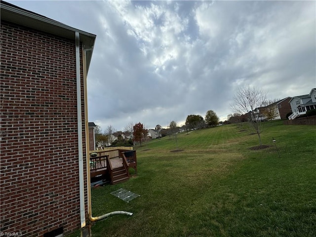 view of yard featuring a wooden deck