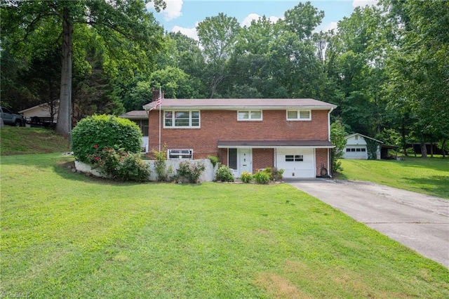 1788 Joshie Dr, Winston-Salem, NC 27103 - view of front of property with brick siding, driveway, a chimney, a front lawn, and a garage