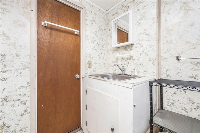 1788 Joshie Dr, Winston-Salem, NC 27103 - washroom featuring wallpapered walls, a sink, and ornamental molding