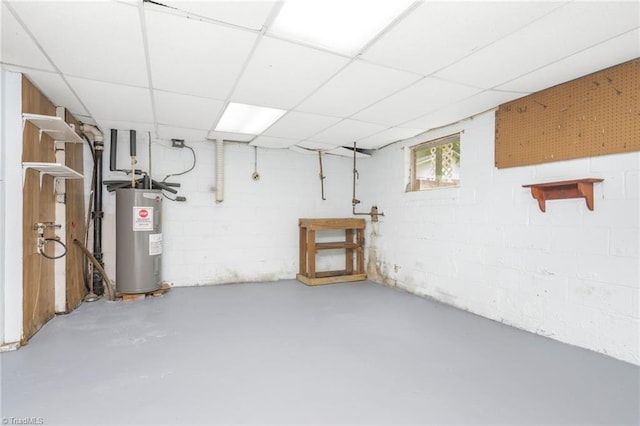 1788 Joshie Dr, Winston-Salem, NC 27103 - basement with electric water heater, concrete block wall, and a paneled ceiling