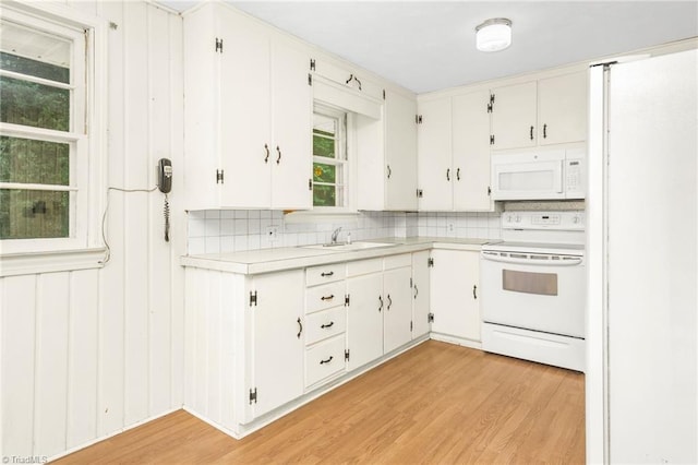 1788 Joshie Dr, Winston-Salem, NC 27103 - kitchen featuring white appliances, a sink, light countertops, and decorative backsplash