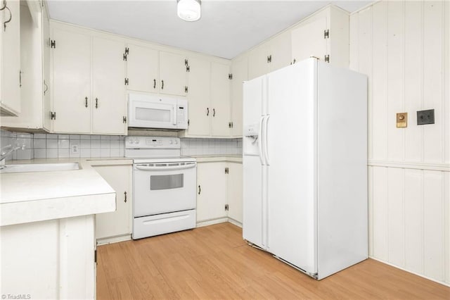 1788 Joshie Dr, Winston-Salem, NC 27103 - kitchen with white appliances, light wood finished floors, light countertops, and backsplash