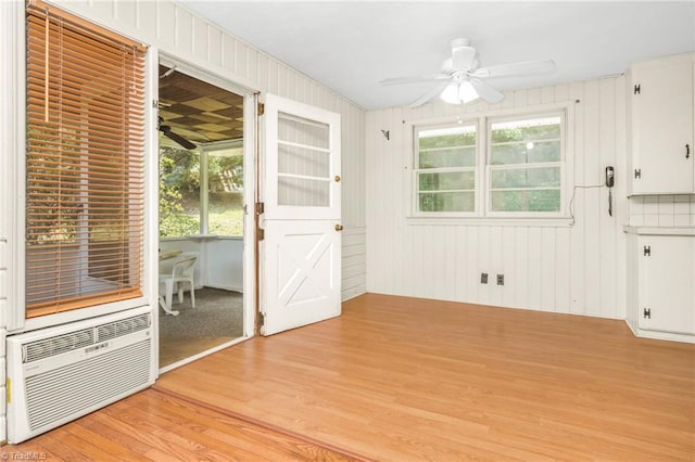1788 Joshie Dr, Winston-Salem, NC 27103 - unfurnished room featuring ceiling fan, light wood-style floors, plenty of natural light, and a wall unit AC