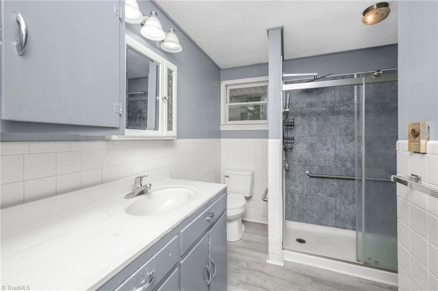 1788 Joshie Dr, Winston-Salem, NC 27103 - bathroom with tile walls, toilet, a shower stall, vanity, and wood finished floors
