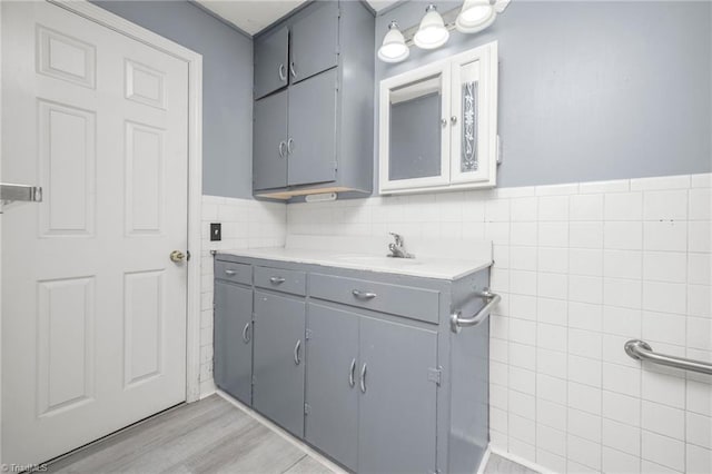 1788 Joshie Dr, Winston-Salem, NC 27103 - bathroom featuring tile walls, vanity, and wainscoting