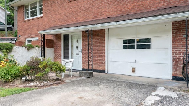 1788 Joshie Dr, Winston-Salem, NC 27103 - entrance to property with driveway, brick siding, and roof with shingles