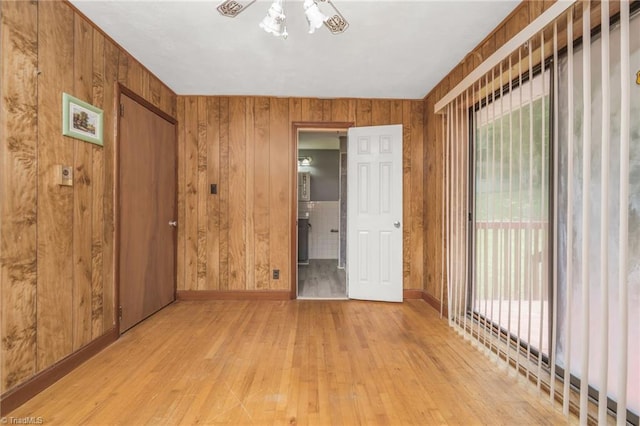 1788 Joshie Dr, Winston-Salem, NC 27103 - spare room with light wood-style flooring, wooden walls, and baseboards