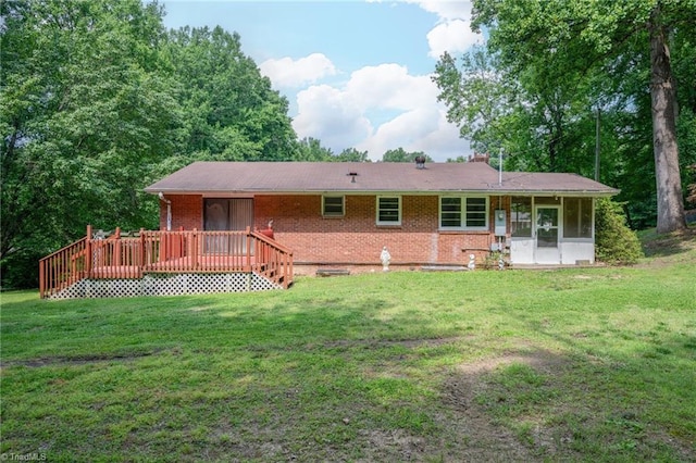 1788 Joshie Dr, Winston-Salem, NC 27103 - back of house featuring a lawn, brick siding, a sunroom, and a deck