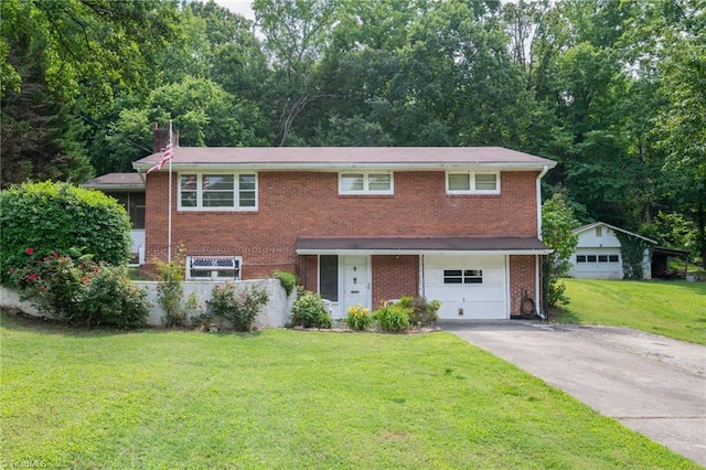 1788 Joshie Dr, Winston-Salem, NC 27103 - traditional home featuring driveway, a garage, a front lawn, brick siding, and a chimney