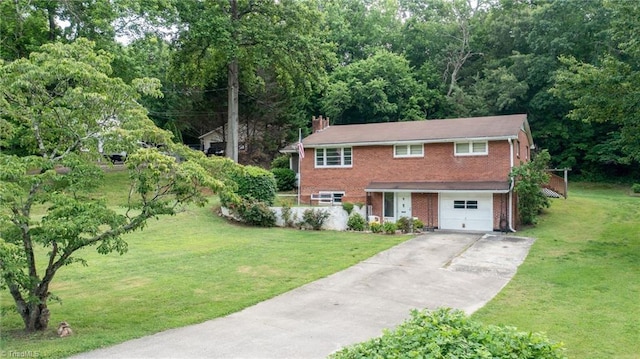 1788 Joshie Dr, Winston-Salem, NC 27103 - view of front of house featuring brick siding, concrete driveway, an attached garage, a front lawn, and a chimney