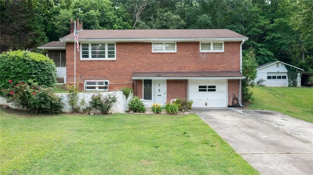1788 Joshie Dr, Winston-Salem, NC 27103 - view of front of house with a front lawn, a chimney, driveway, an attached garage, and brick siding